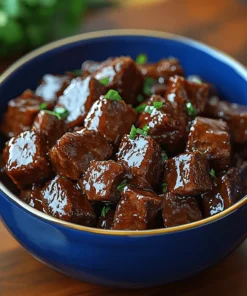 Smoky, tender chopped beef with a hint of BBQ glaze in a bright blue bowl – Chopped Beef Pound