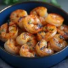 Succulent grilled shrimp in a bright blue bowl, seasoned with house blend spices β Grilled Shrimp 3 Dozen